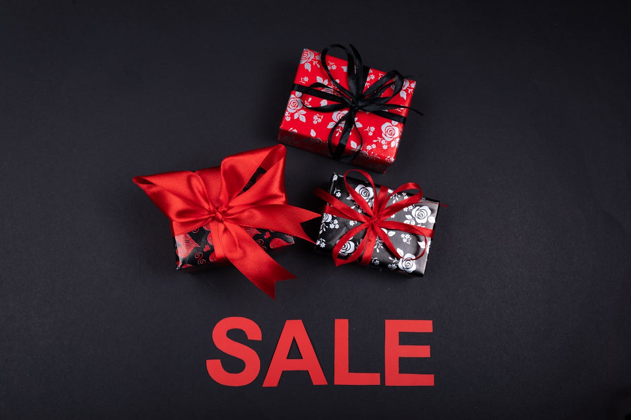 services-03 Stylish gift boxes with red ribbons on sale. Perfect for promotions and festive occasions.